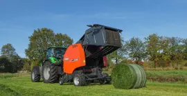 A view of a VB 3160 ejecting a bale from behind the machine