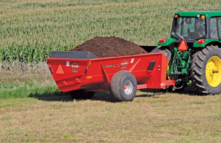 SL 110 fully loaded with manure in a field.