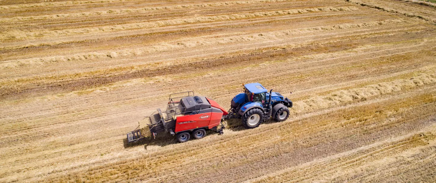 SB 1290 iD baling in a straw field