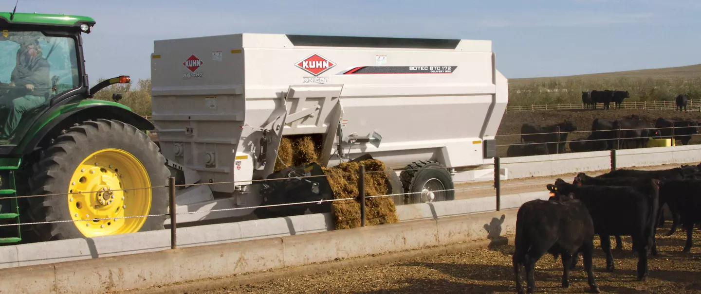 BTC 155 delivery trailer delivering feed to beef cattle.