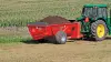 SL 110 fully loaded with manure in a field.